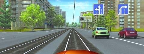 In this situation is the driver allowed to drive on the railway lines?
