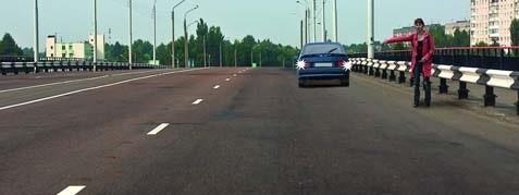 Is the passenger car driver allowed to approach the passenger on the bridge while reversing?