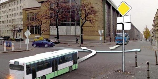 The passenger car will drive through the intersection: